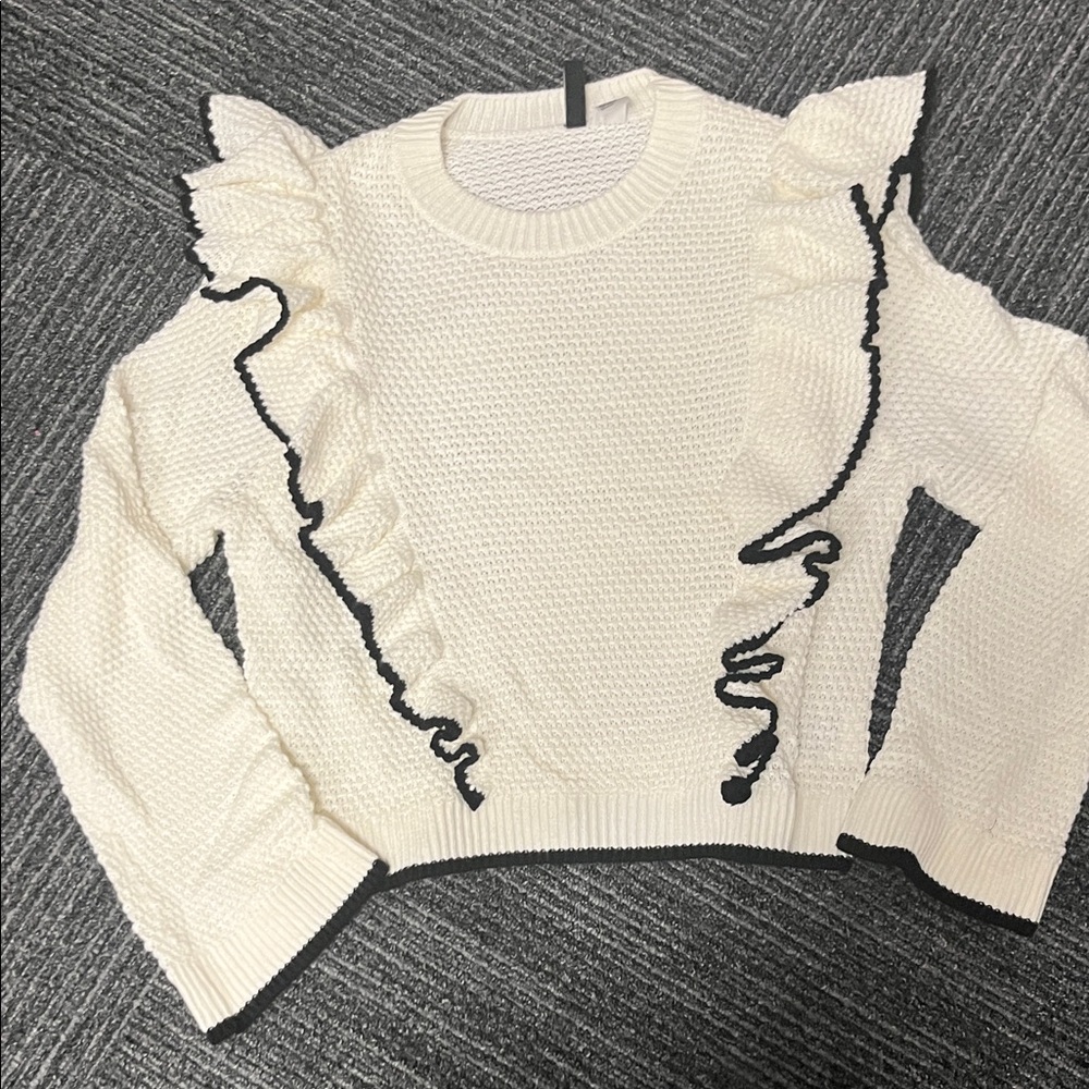 Divided White Sweater with Black Ruffle Accents